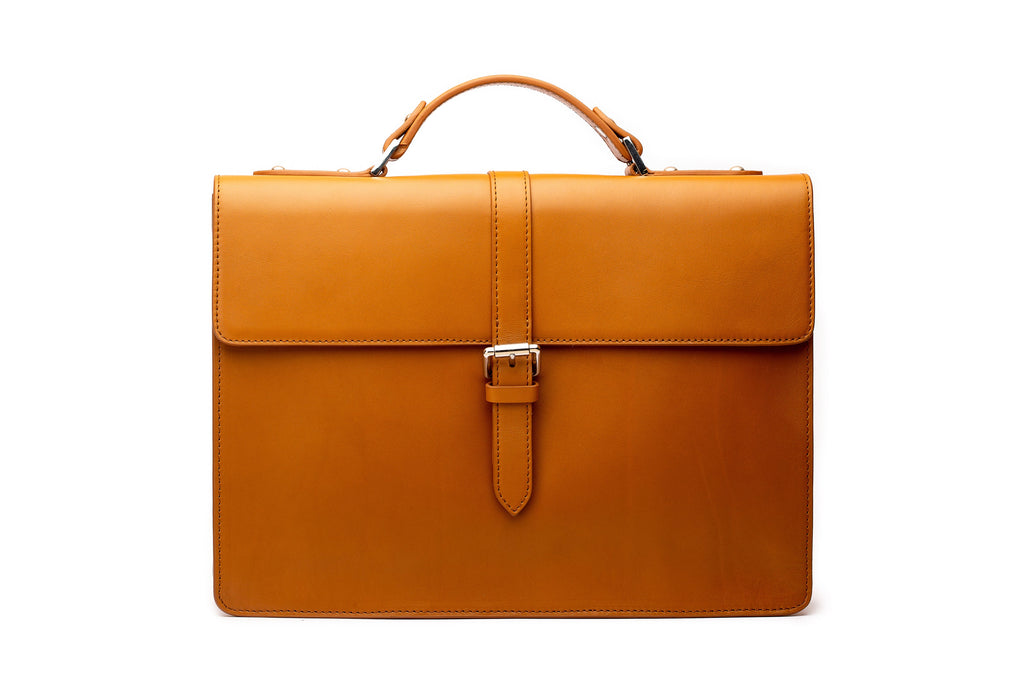 Tan leather laptop briefcase front view showing structured leather exterior