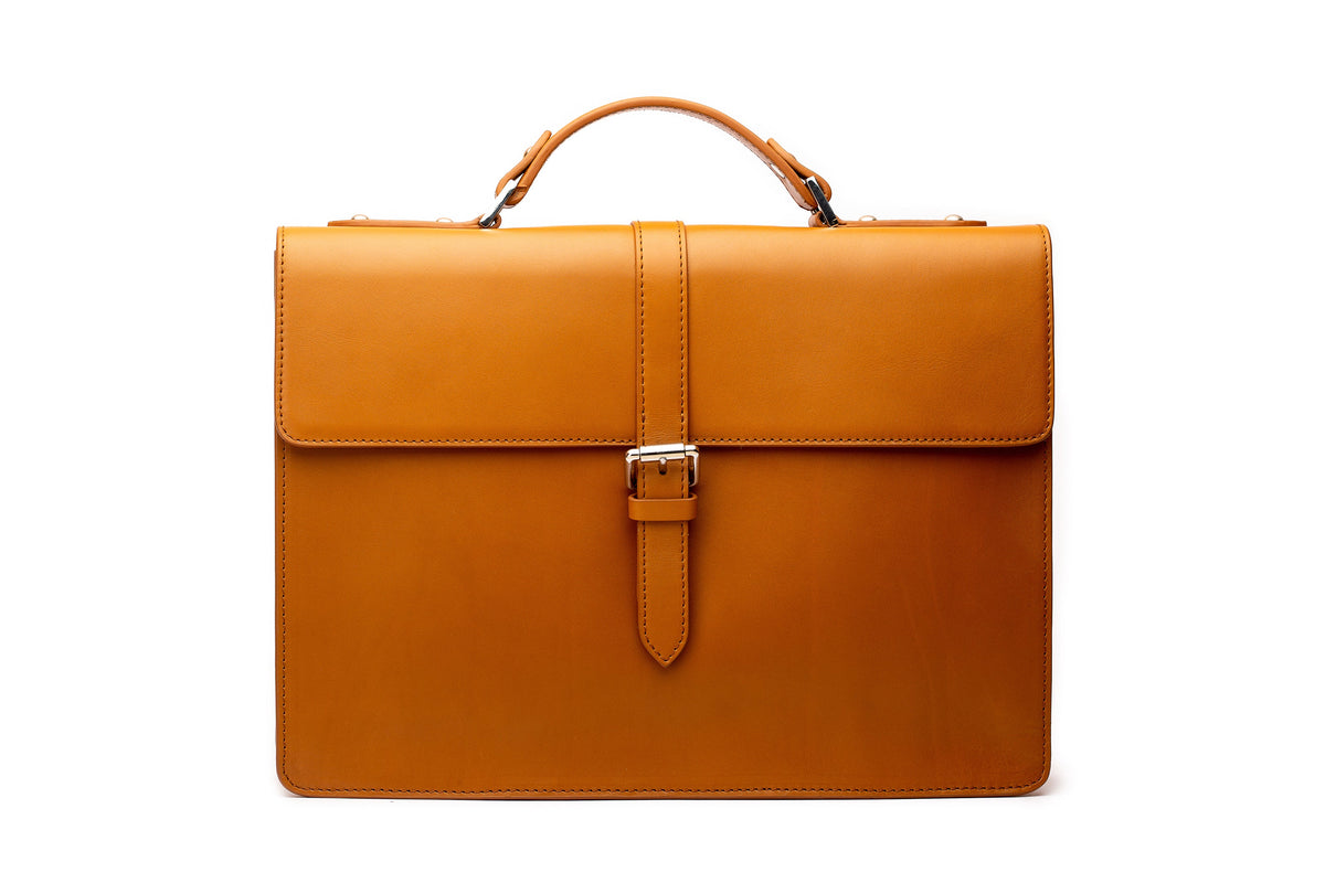 Tan leather laptop briefcase front view showing structured leather exterior