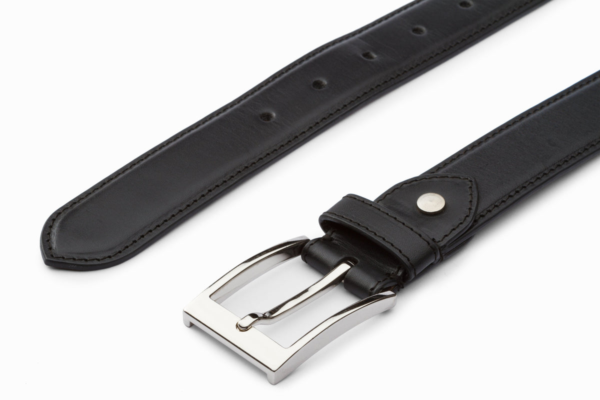 Black leather flat belt close-up buckle and hole detail
