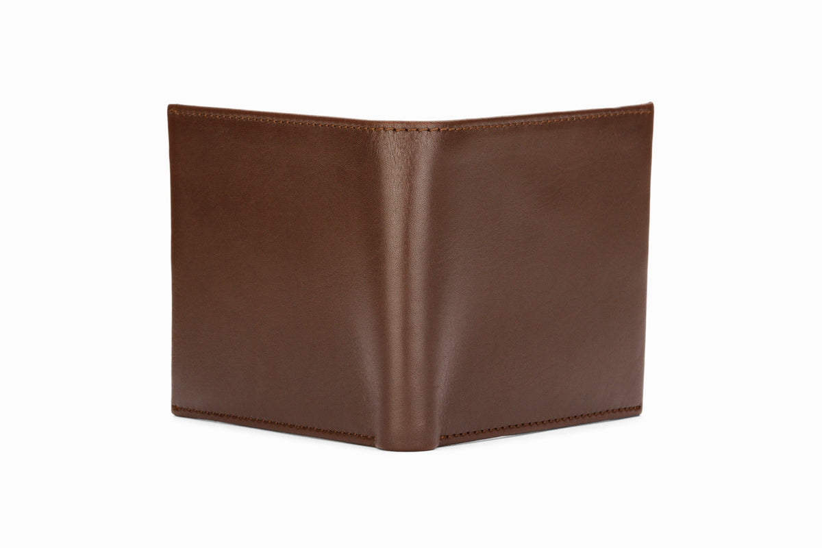 Dark brown slim wallet close-up corner and stitching detail