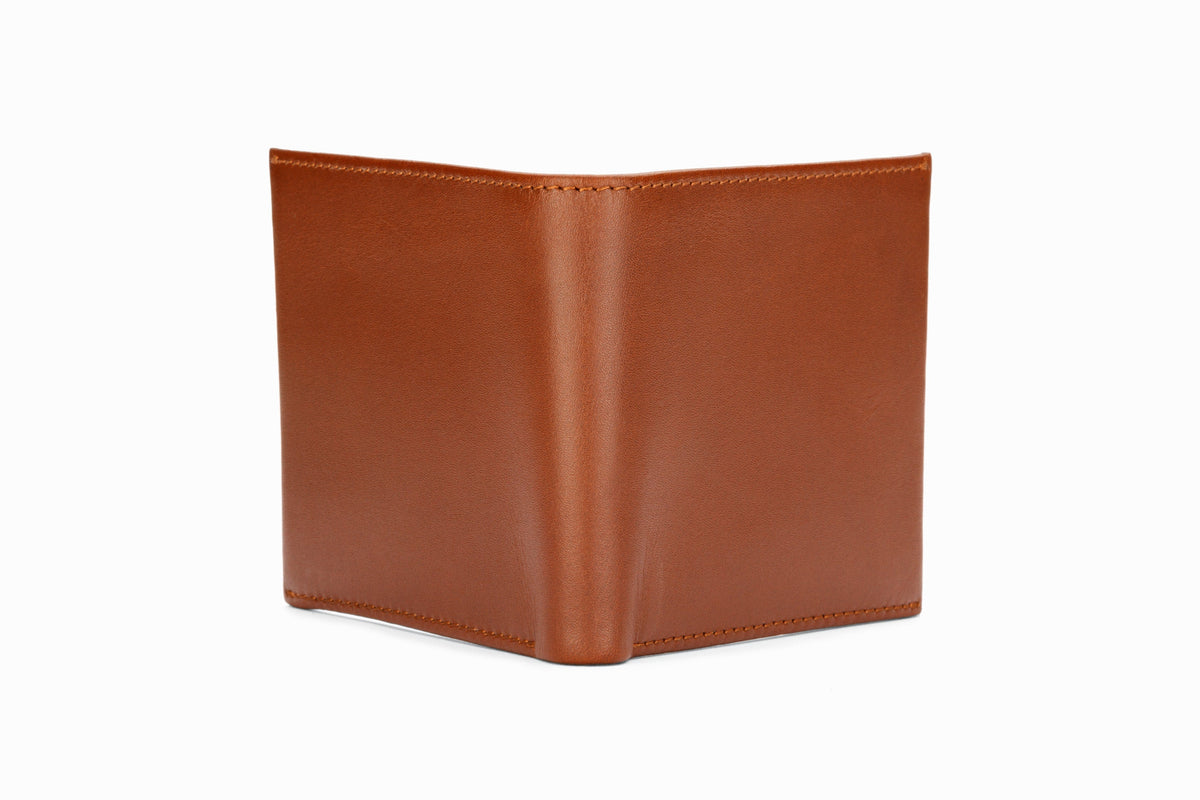 Medium brown slim wallet close-up corner and stitching detail