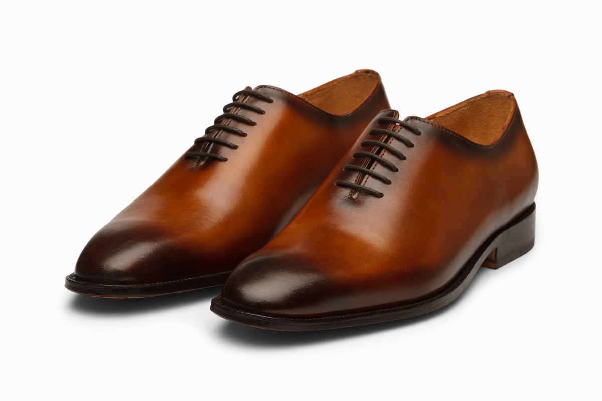 Wholecut Oxford Tan Brown Patina three-quarter front view on white background