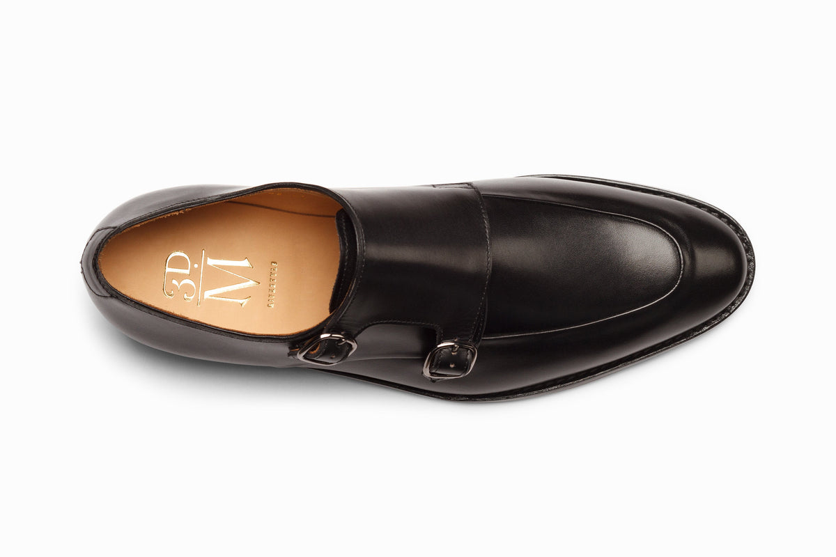 Black diplomat double monkstrap on-foot walking lifestyle shot