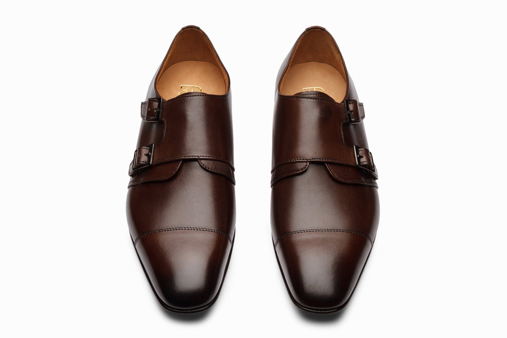 Dark brown off-centered monkstrap on-foot lifestyle shot with chinos