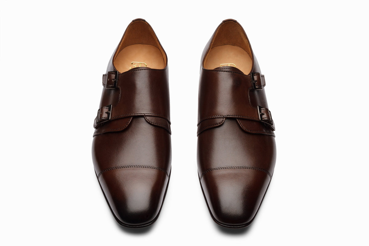 Dark brown off-centered monkstrap on-foot lifestyle shot with chinos