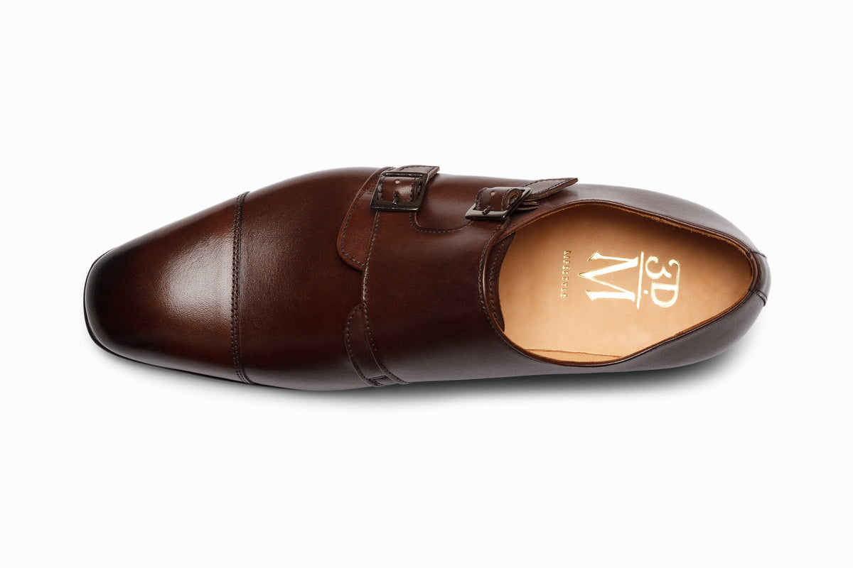 Dark brown off-centered double monkstrap on-foot walking shot