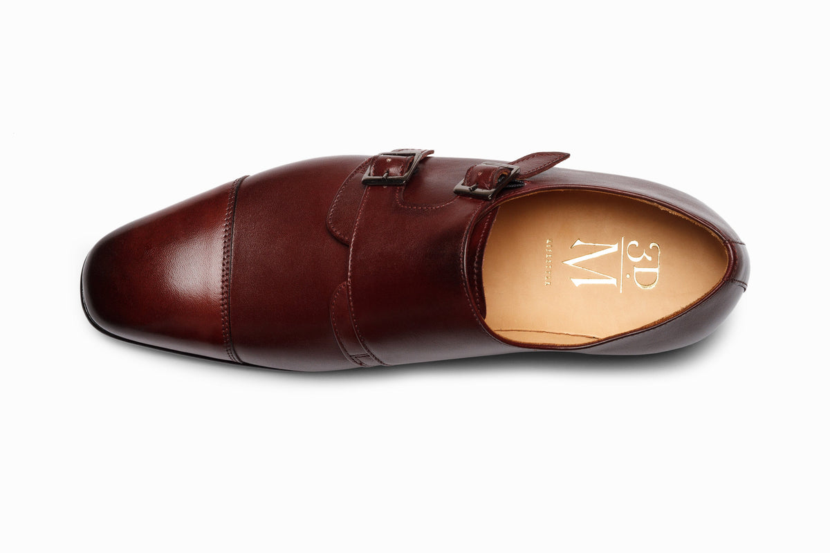 Burgundy off-centered double monkstrap on-foot walking lifestyle shot