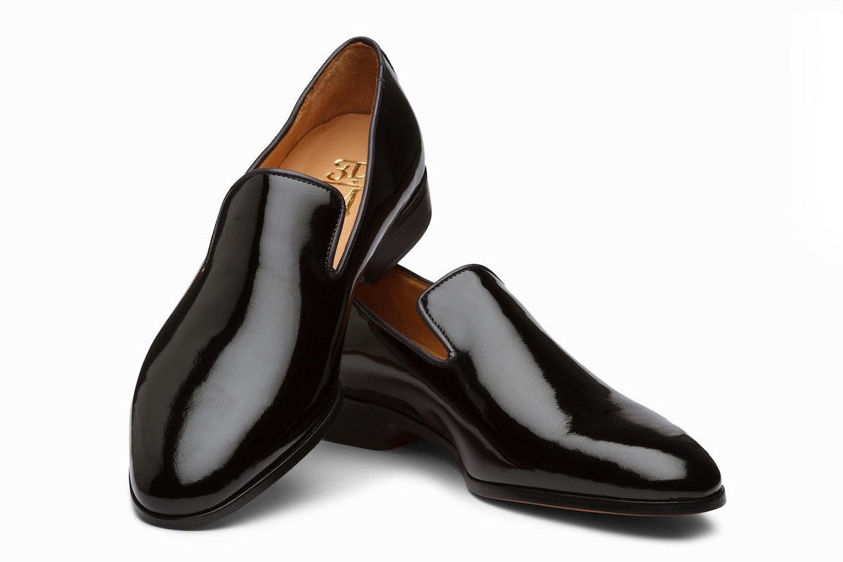 Black Patent Venetian loafer on-foot lifestyle shot with tuxedo trousers