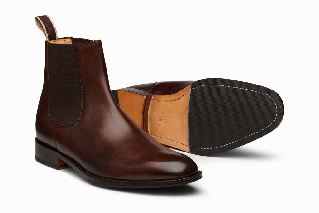 Dark brown Chelsea boot lifestyle styled shot showing elastic gusset