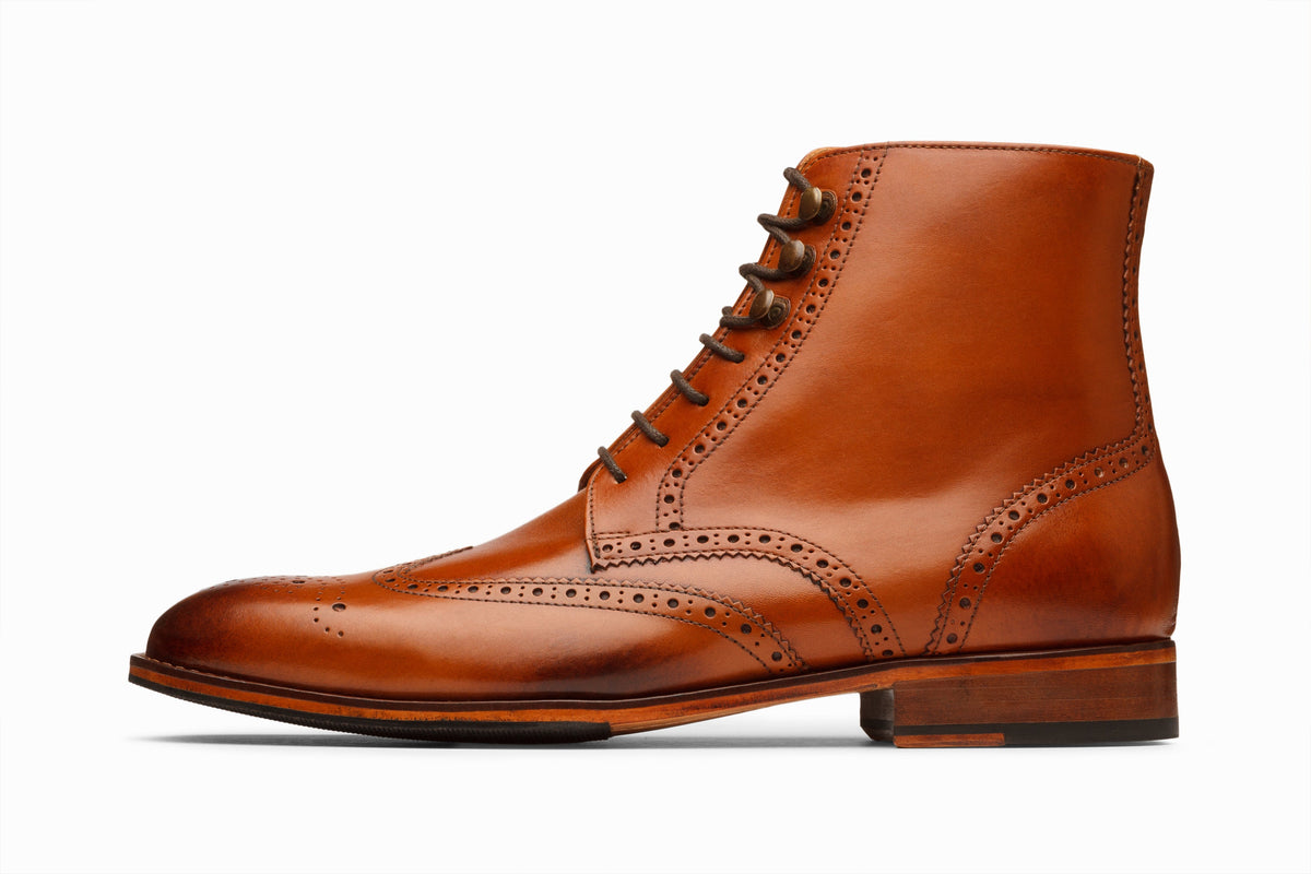 Tan leather wingtip brogue boot sole and outsole detail