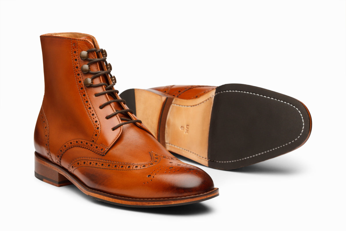 Tan wingtip brogue boot lifestyle styled shot showing full brogue
