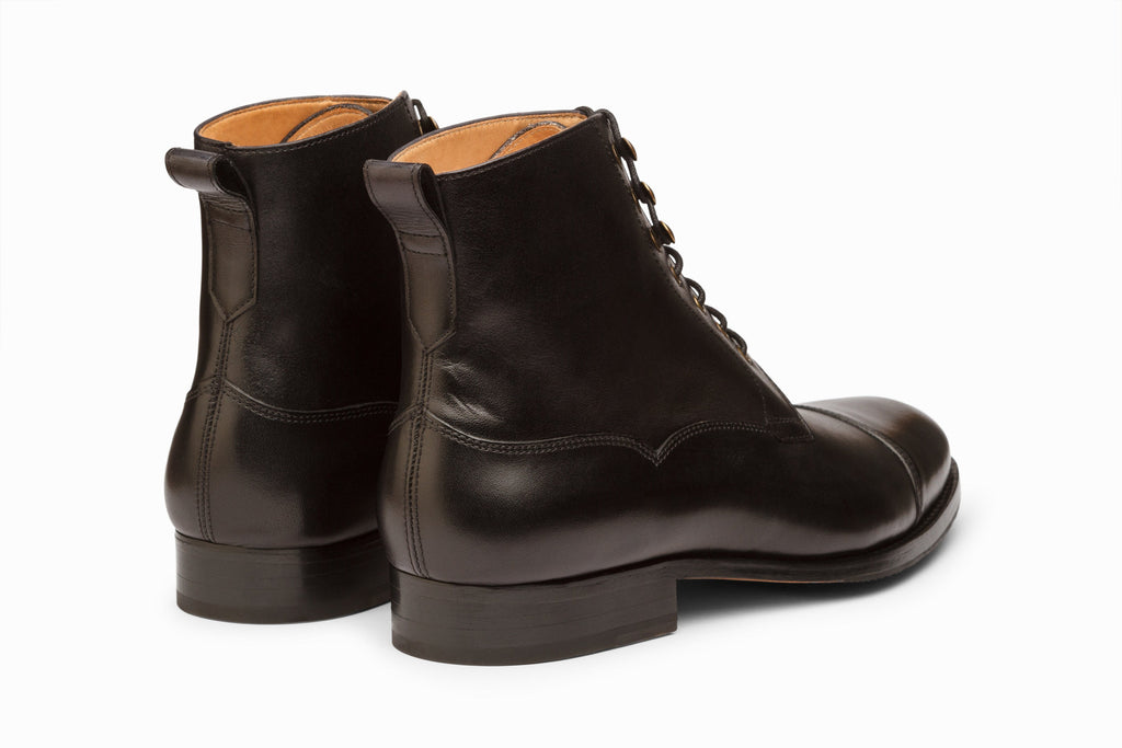 Black derby boot on-foot styled view with suit trousers