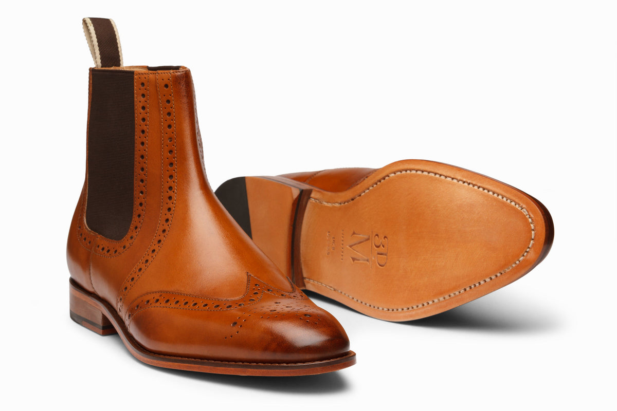 Tan wingtip Chelsea brogue boot rear heel view showing elastic gusset