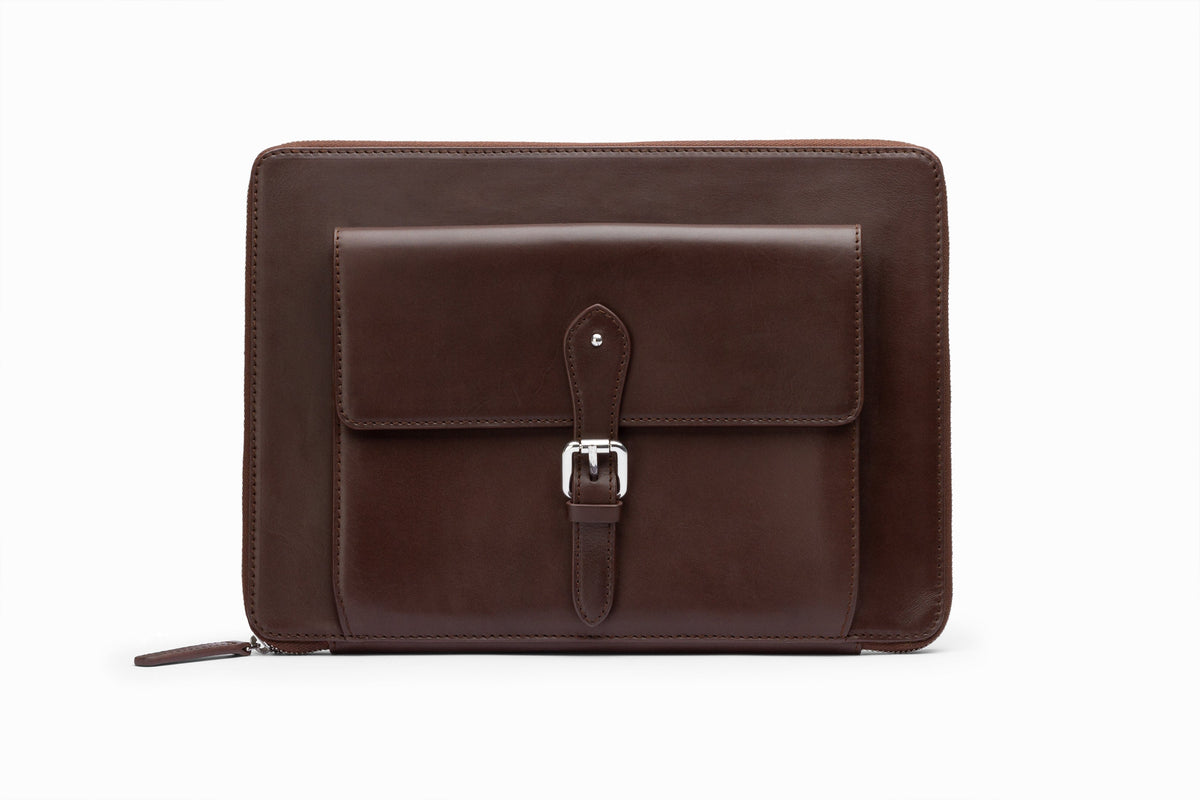 Dark brown leather laptop sleeve front view showing structured calfskin exterior