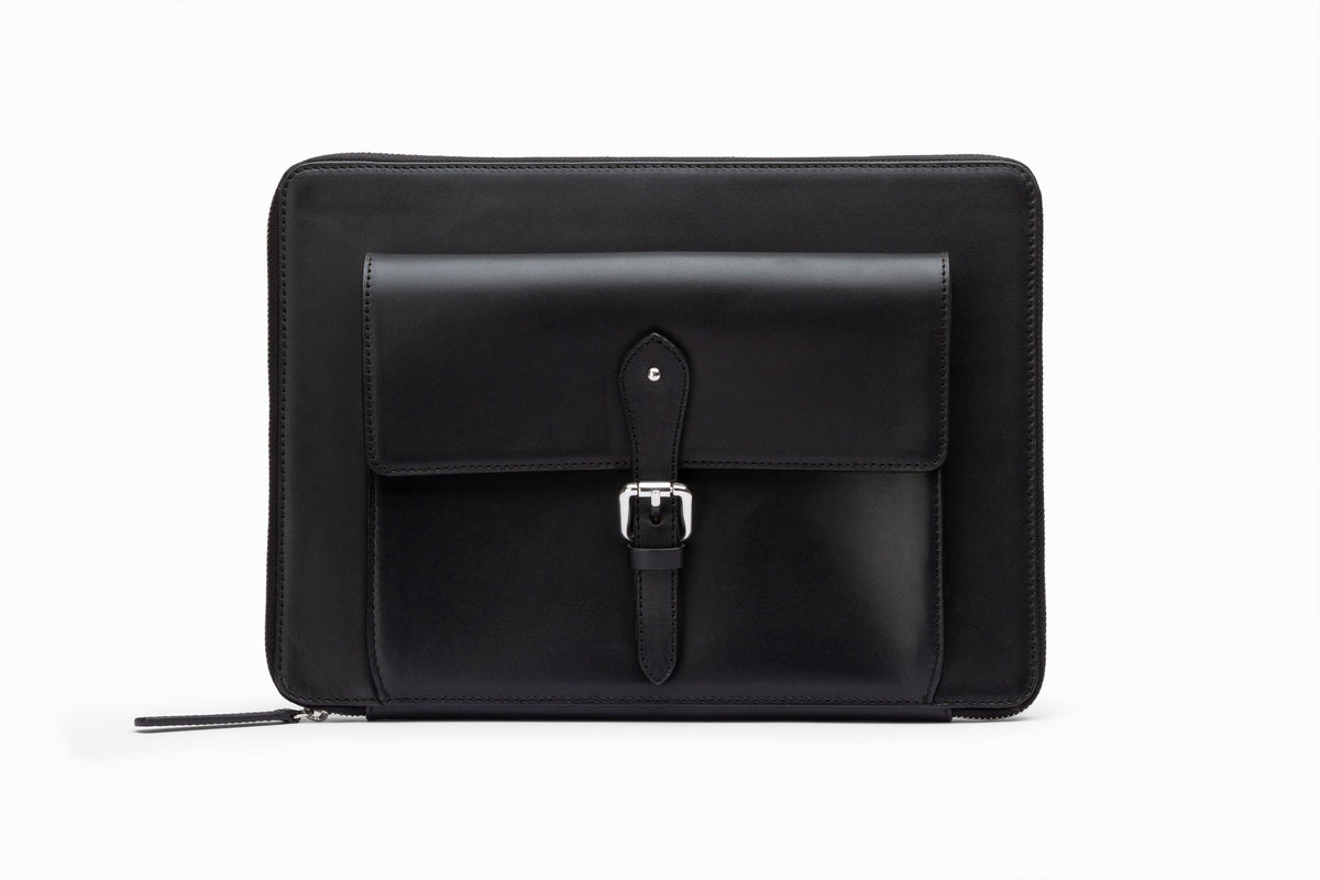 Black leather laptop sleeve front view showing structured calfskin exterior