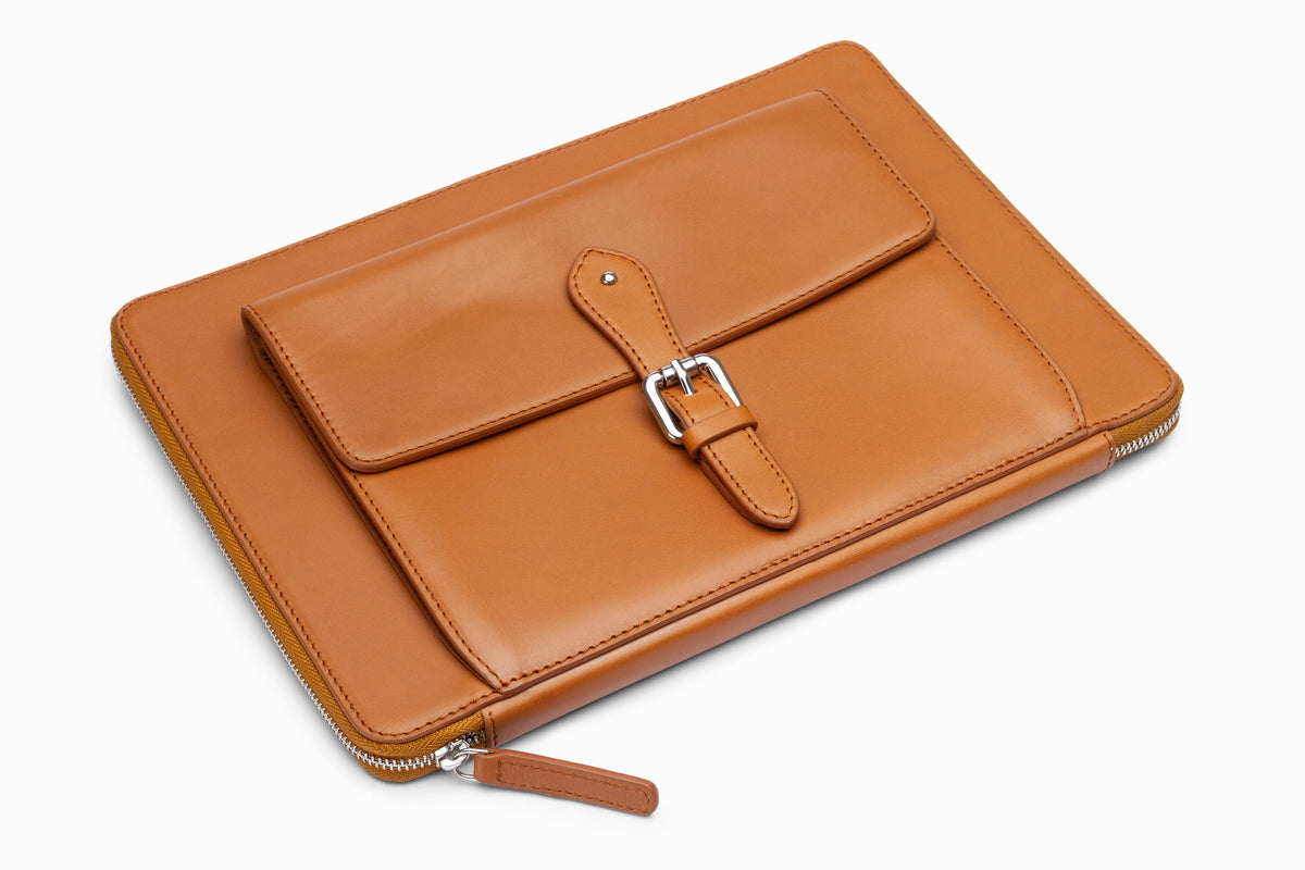 Tan leather laptop sleeve side profile showing slim calfskin construction