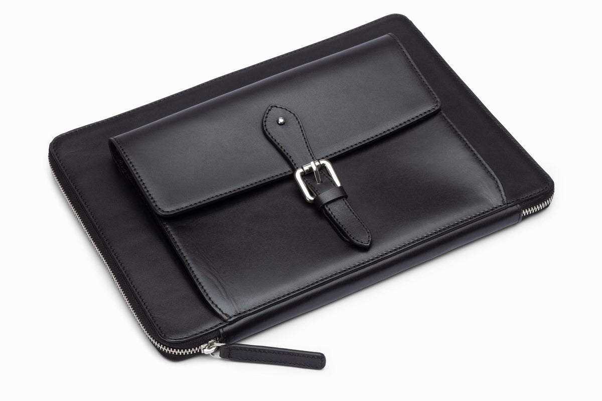 Black leather laptop sleeve side profile showing slim construction