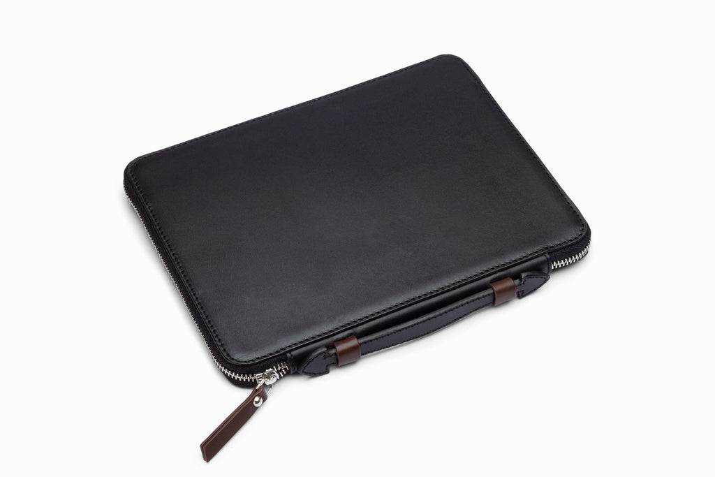 Black leather iPad case side profile showing slim leather construction
