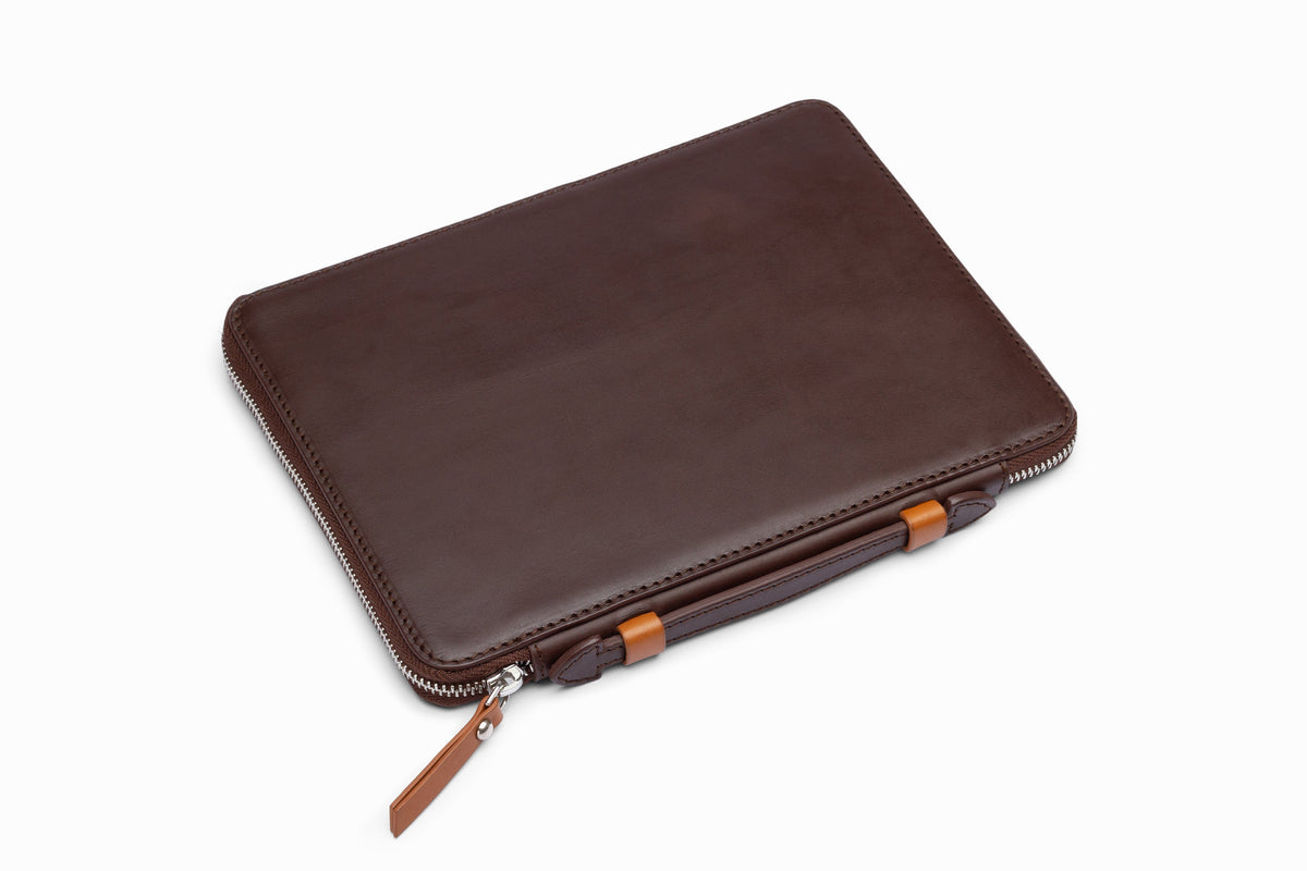 Brown leather iPad case side profile showing slim leather construction