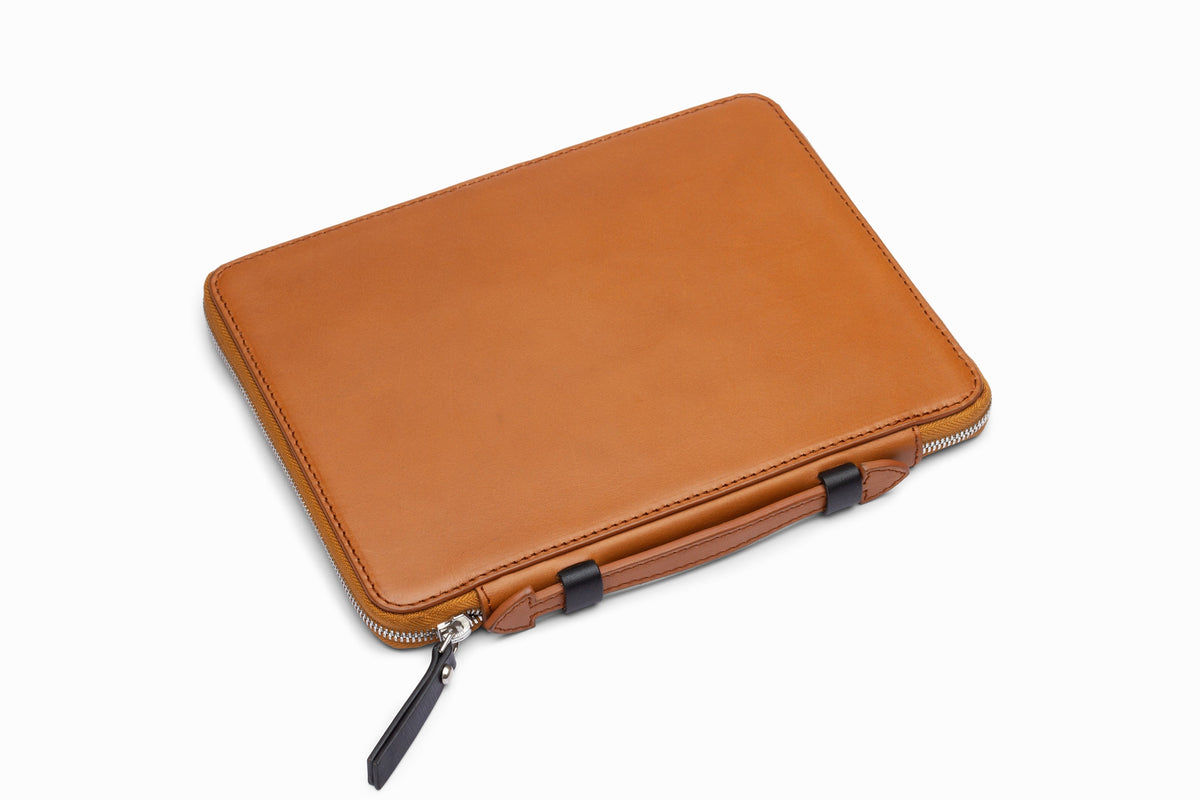 Tan leather iPad case side profile showing slim calfskin construction