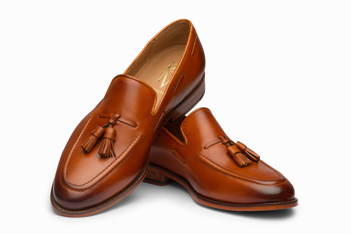 Tan tassel loafer sole and leather outsole detail