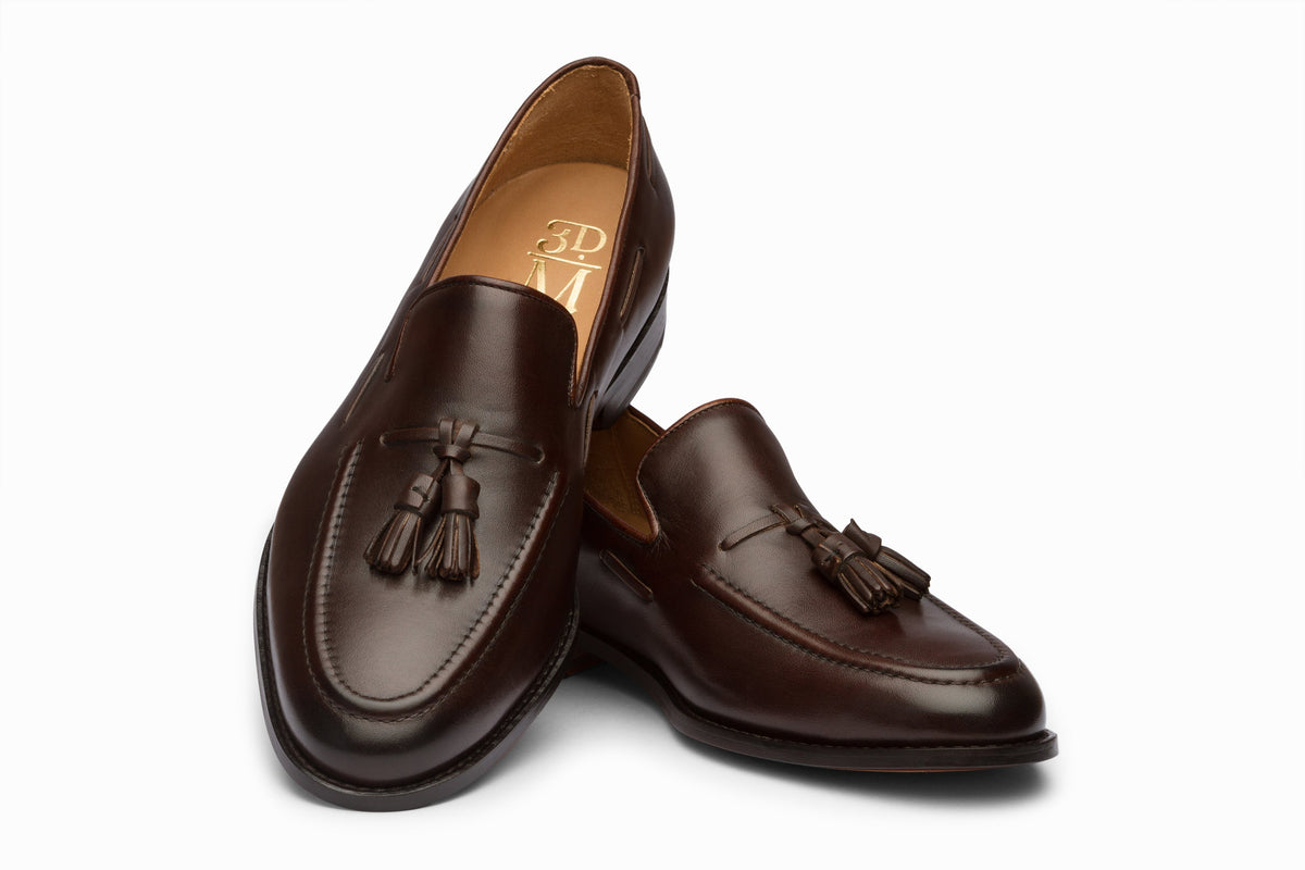 Dark brown tassel loafer sole and leather outsole detail