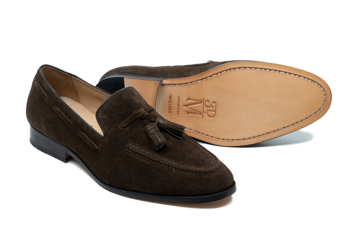 Dark brown suede tassel loafer side profile showing suede texture and tassel