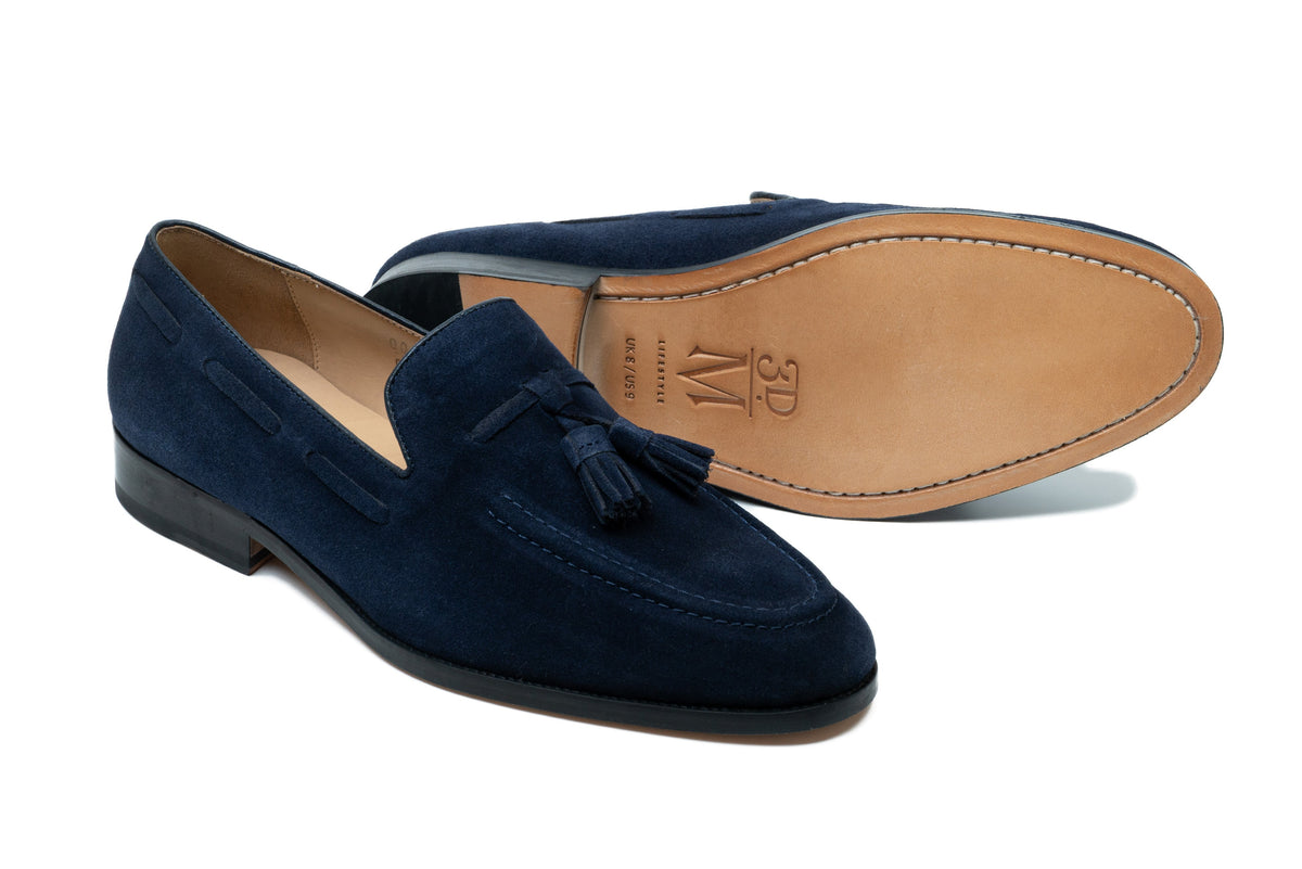 Navy suede tassel loafer side profile showing rich suede texture and tassel