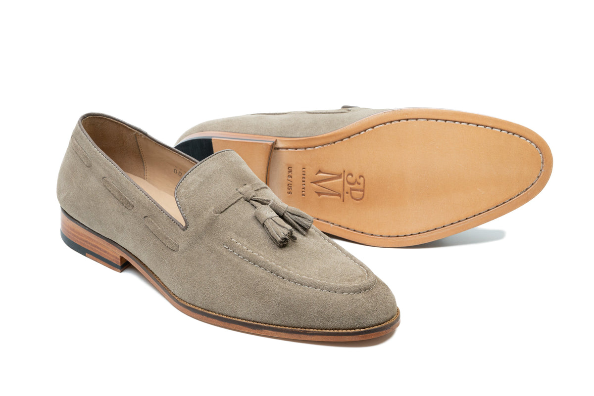 Taupe suede tassel loafer side profile showing suede texture and tassel