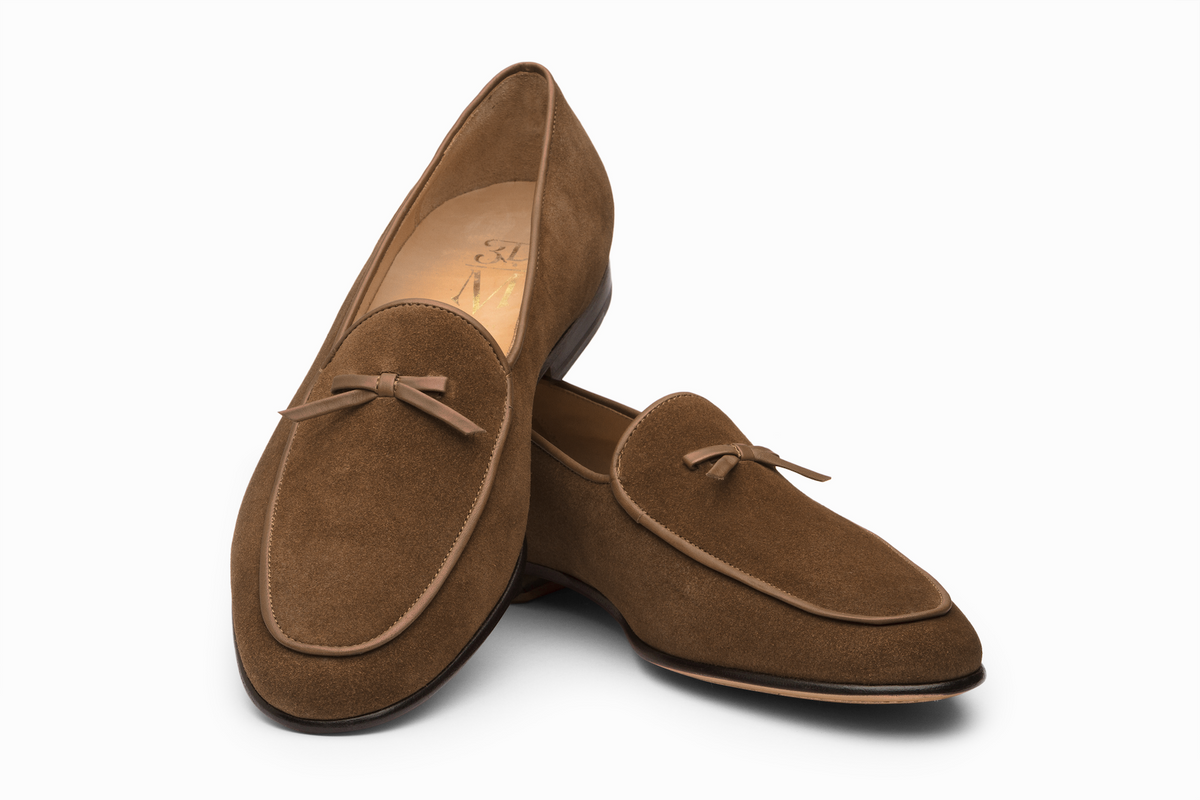 Tobacco suede Belgian loafer three-quarter rear view showing heel and string stitch vamp