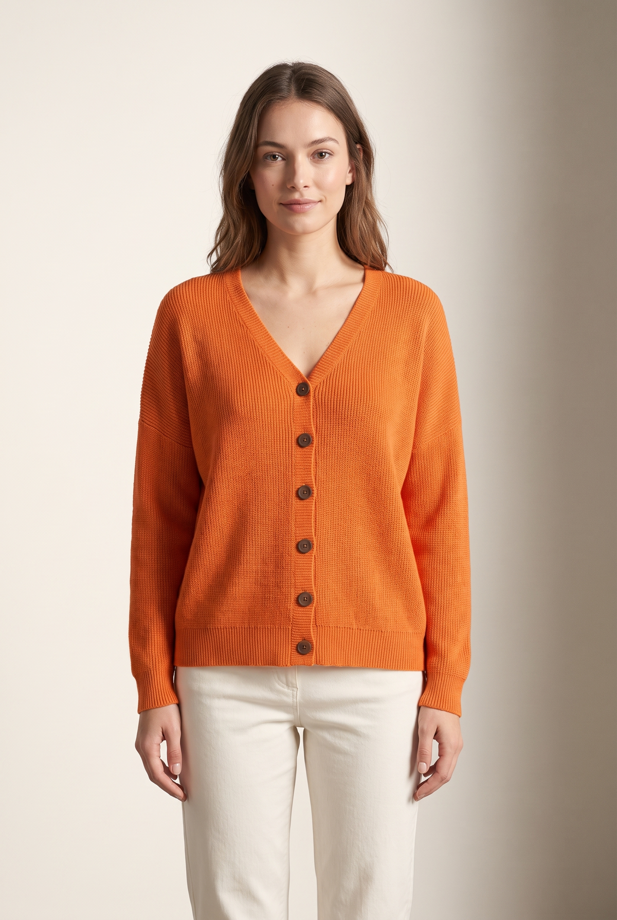 Melanie Women's Button-Front V-Neckline Stretch-Knit Comfort Cardigan in Orange, on model