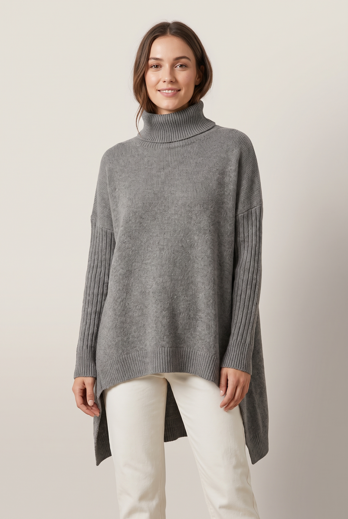 Women's Oversized Ribbed Turtleneck High-Low Hem Sweater in Stone Gray, on model