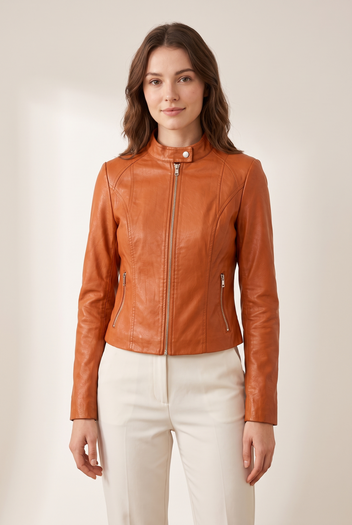 Sienna Women's Cropped Faux Leather Moto Jacket in Orange, on model