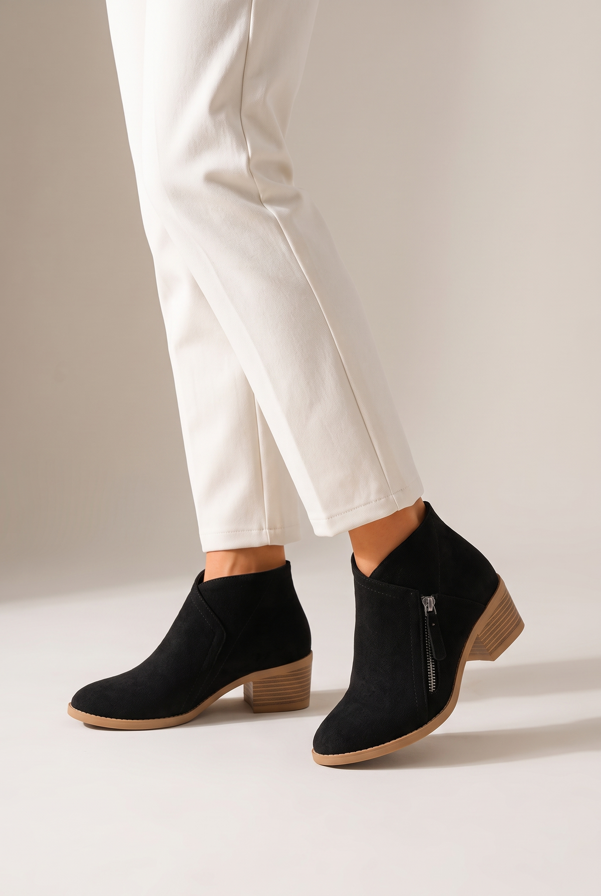 Sophie Women's Faux Suede Low-Heel Side-Zip Chelsea Boots in Black, on model