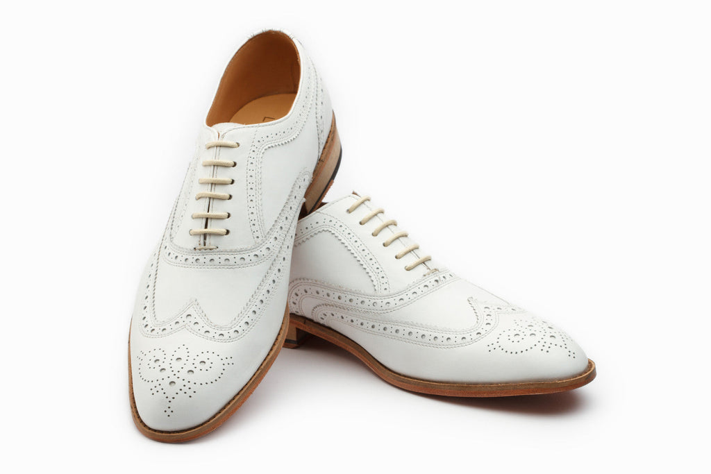 White wingtip Oxford side profile showing full brogue detailing