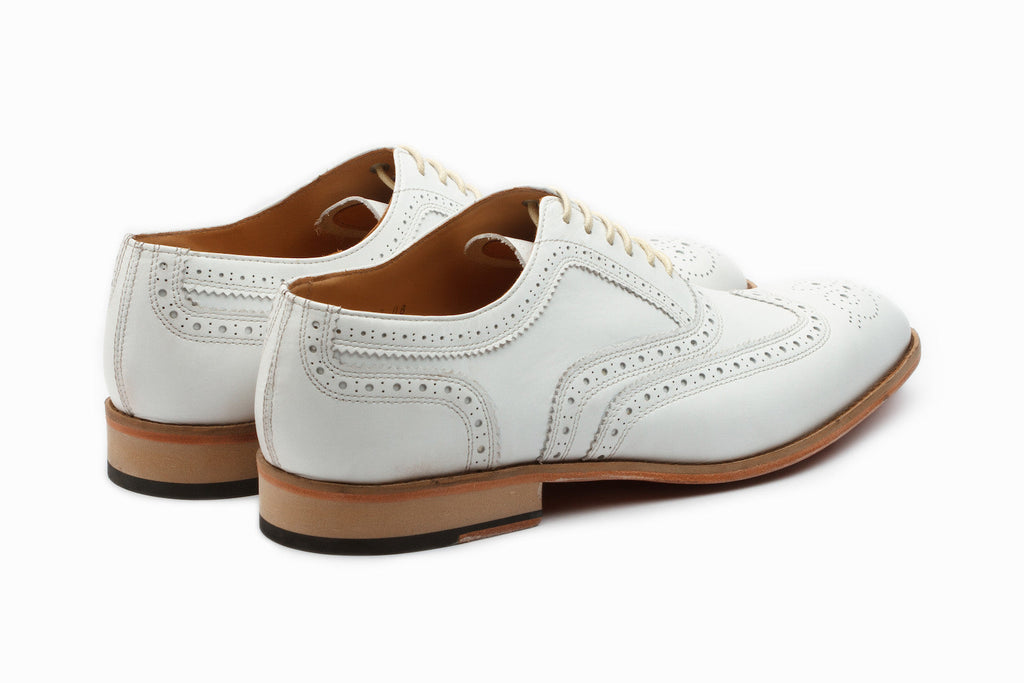 White full brogue Oxford top-down flat lay view